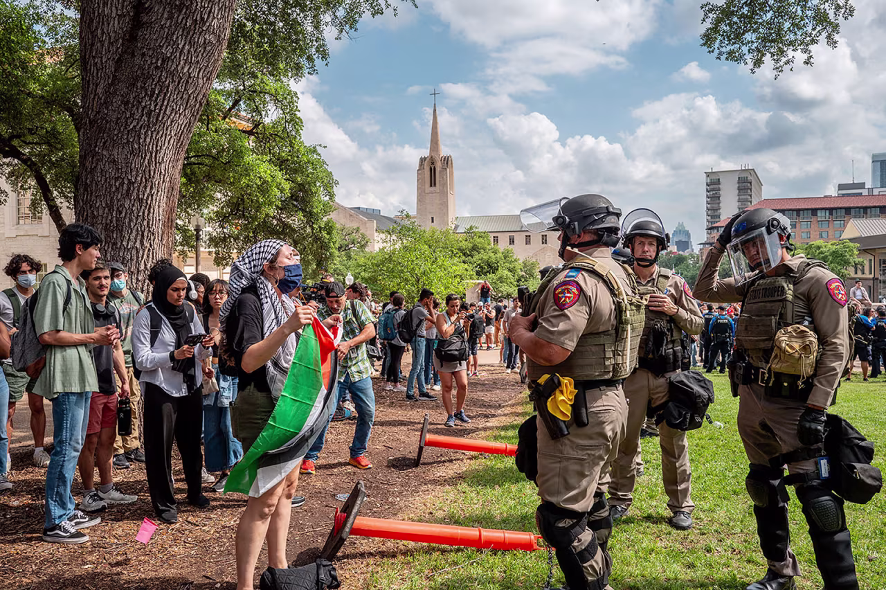 Students speak with law enforcement during a pro-Palestine protest at the The University of Texas at Austin on Wednesday, April 24, 2024 in Austin, Texas. 