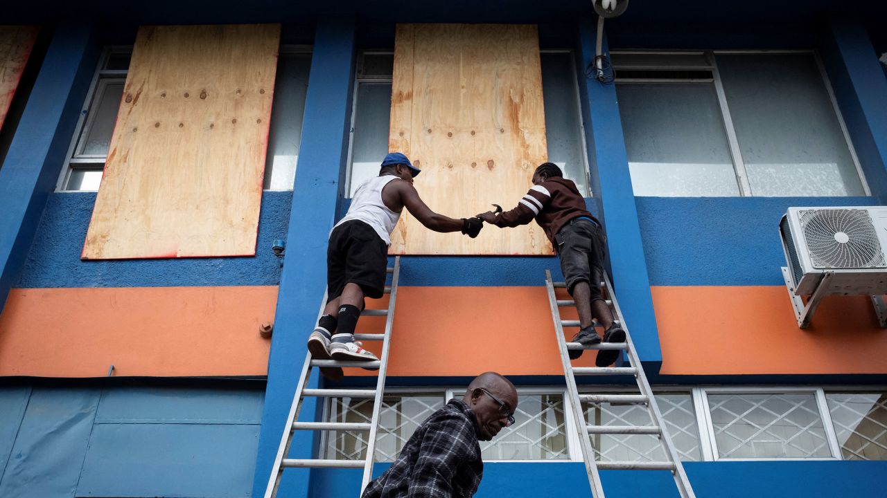 Workers board up windows as Hurricane Beryl approaches, in Kingston, Jamaica, on July 3,