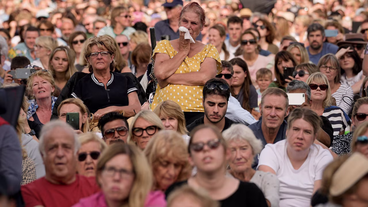 People gather in London's Hyde Park, where video screens broadcast Wednesday's events.