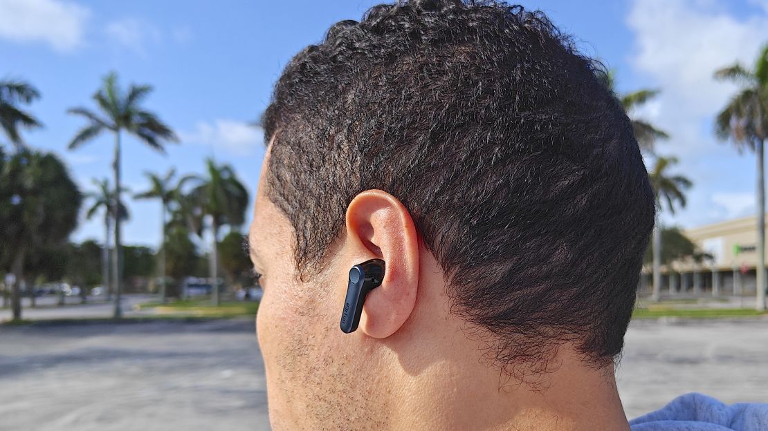 Person wearing EarFun Air Pro 4 in left ear.