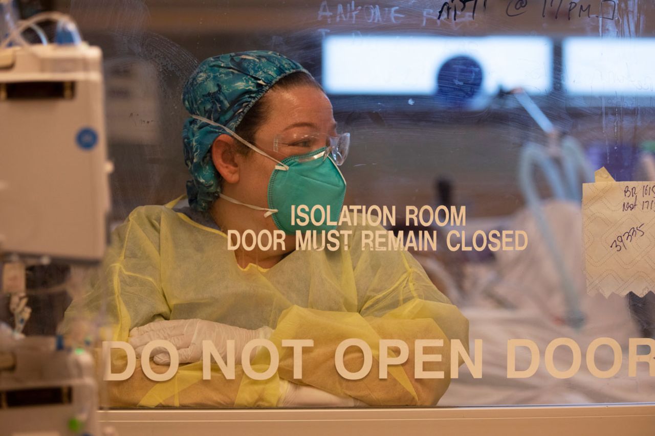 A nurse works with a Covid-positive patient inside the ICU at Martin Luther King Jr. Community Hospital in Los Angeles, California, on December 17.