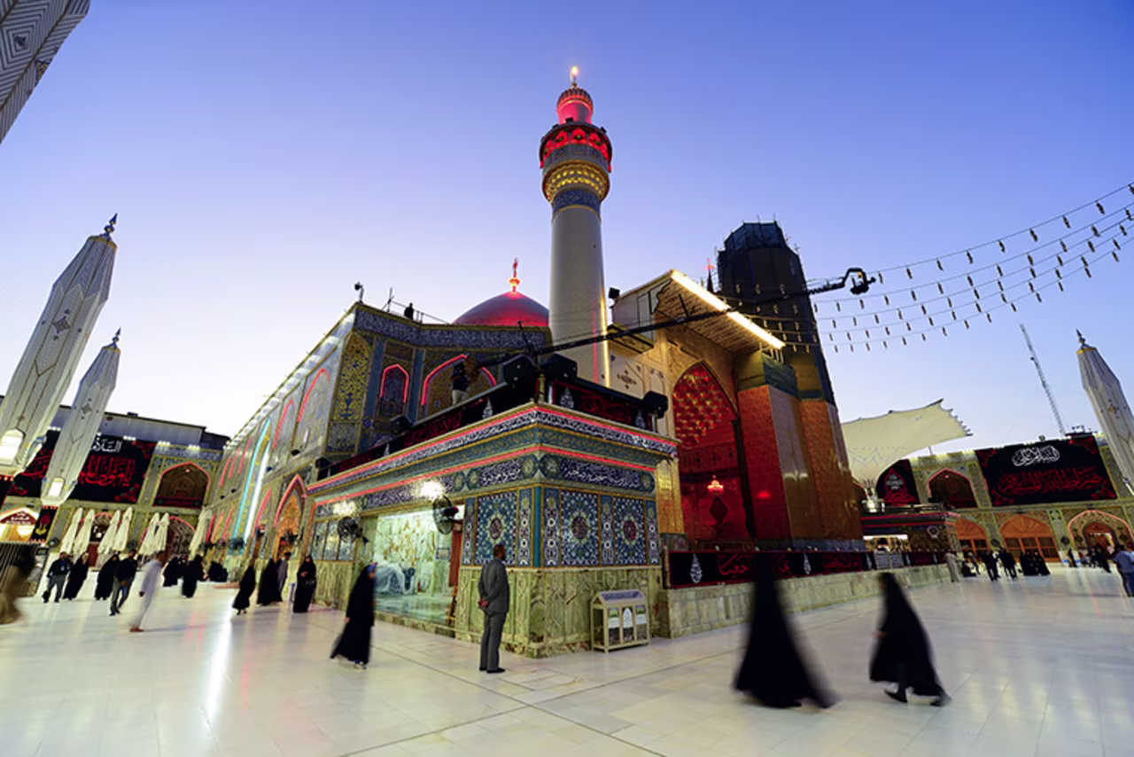 Shiite Muslims gather at the Imam Ali shrine in the central Iraqi holy city of Najaf on May 16, amid the COVID-19 pandemic, to mark Lailat al-Qadr, a night in the Muslim holy month of Ramadan during which the Koran was first revealed to the Prophet Mohammed in the seventh century. 