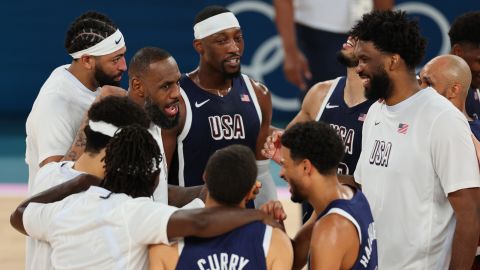 Team USA huddles after their victory against Brazil in Paris, on August 6.