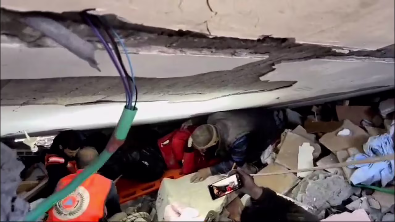 Civil Defense crews work recover victims from under the rubble of the Abu Shamala family home in Gaza City on Monday, March 11. 