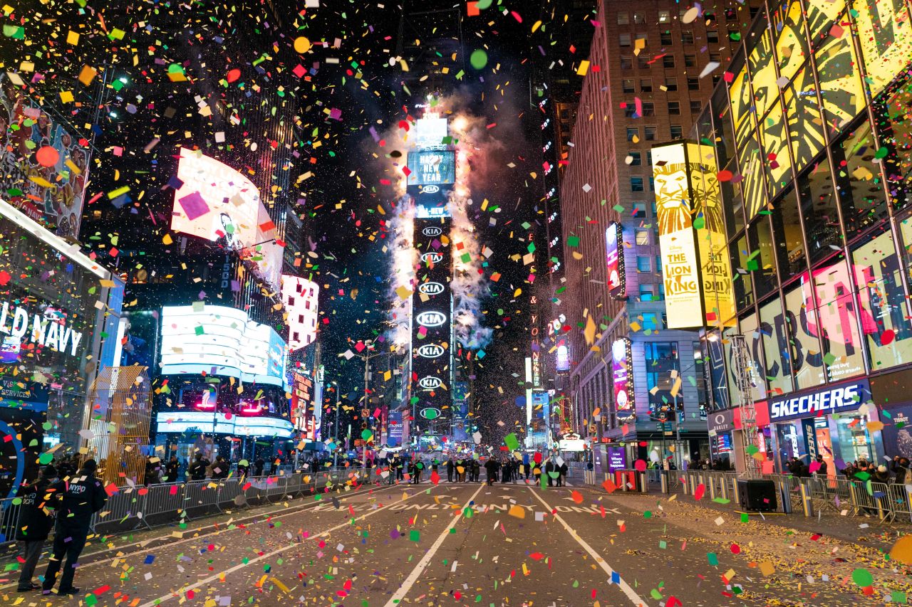 Confetti are flying in the air on a mostly empty Times Square for New Years Eve in New York City on January 1, 2021.