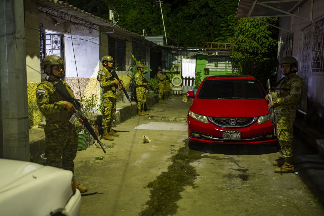 Armed personnel patrol a neighborhood of San Salvador, looking for any remnants of gangs.