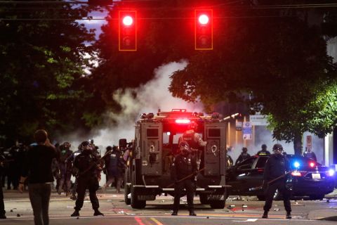 Police patrol after dispersing a protest on Monday night in Seattle.