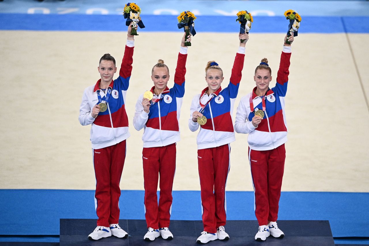 Russia's Liliia Akhaimova, Angelina Melnikova, Viktoriia Listunova and Vladislava Urazova celebrate on the podium after winning the artistic gymnastics women's team final in Tokyo on July 27.