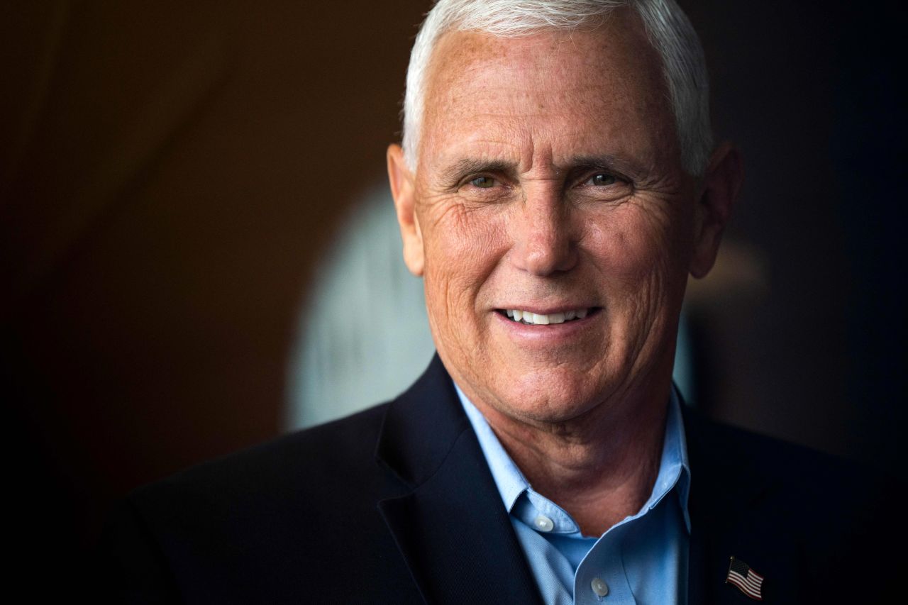 Former Vice President Mike Pence greets people at a campaign event in Waukee, Iowa, on June 8. 