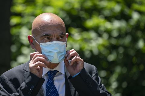 Moncef Slaoui listens as President Donald Trump delivers remarks about coronavirus vaccine development in the Rose Garden on May 15, in Washington. 