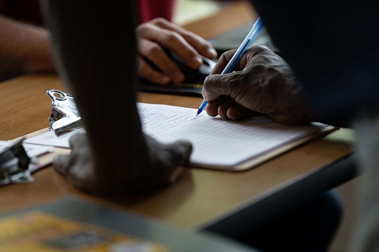 An attendee signs into a career fair hosted by the New Hanover NCWorks and the Cape Fear Workforce Development Board in Wilmington, North Carolina, in June. 