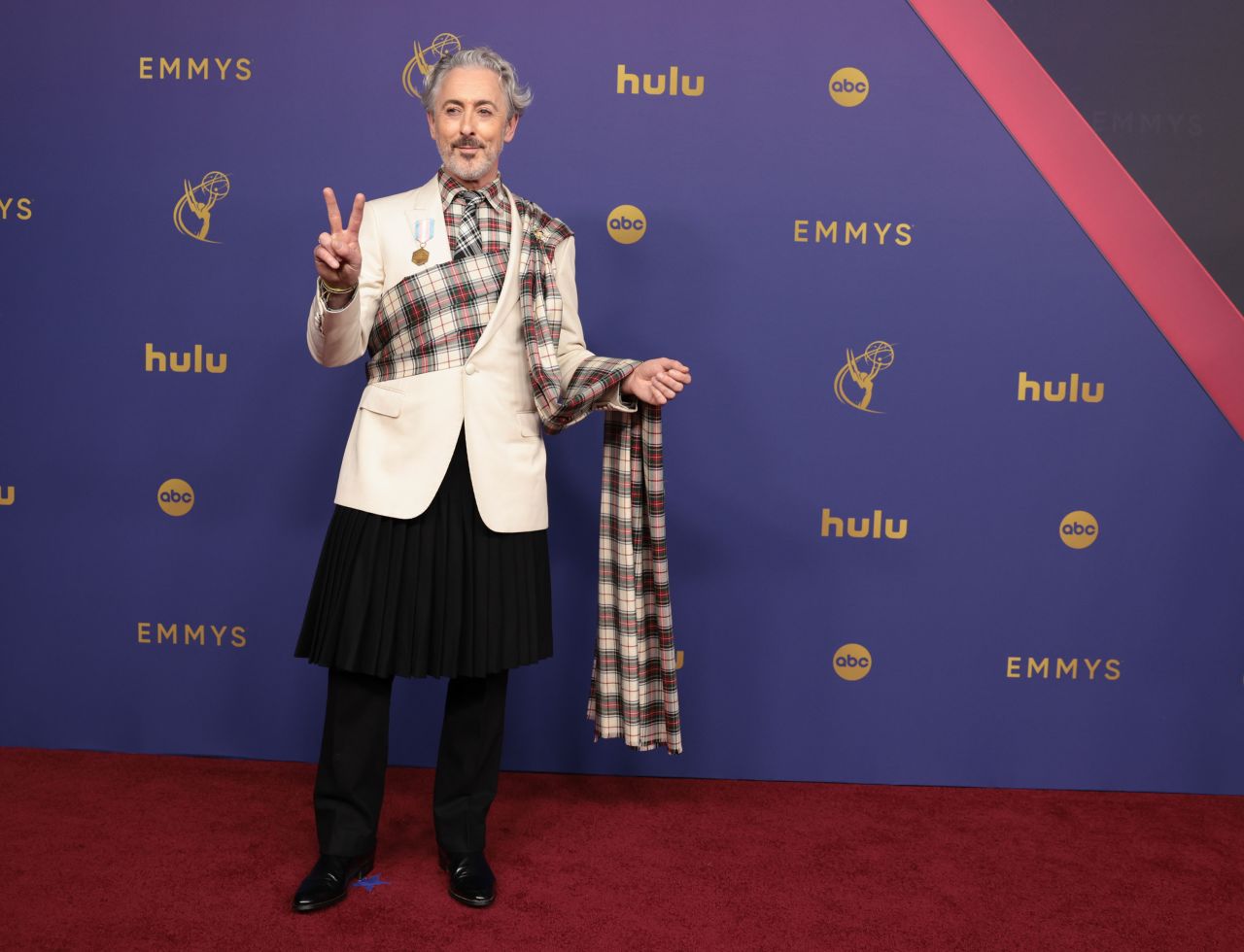 Alan Cumming arrives at the Emmy Awards in Los Angeles on September 15. 