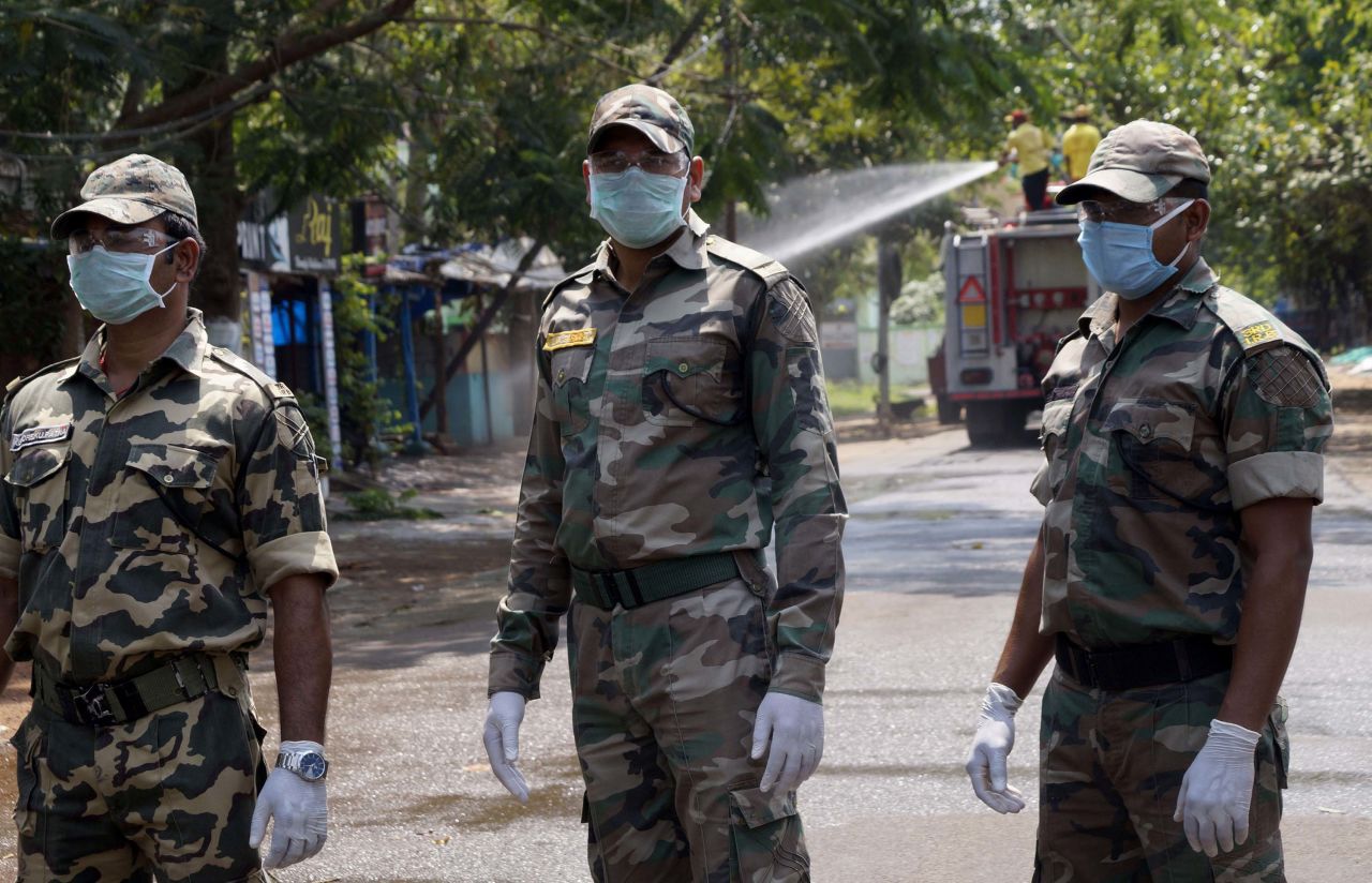 Police stand guard during lockdown in Bhubaneswar, the capital city of India's Odisha state, on April 4.