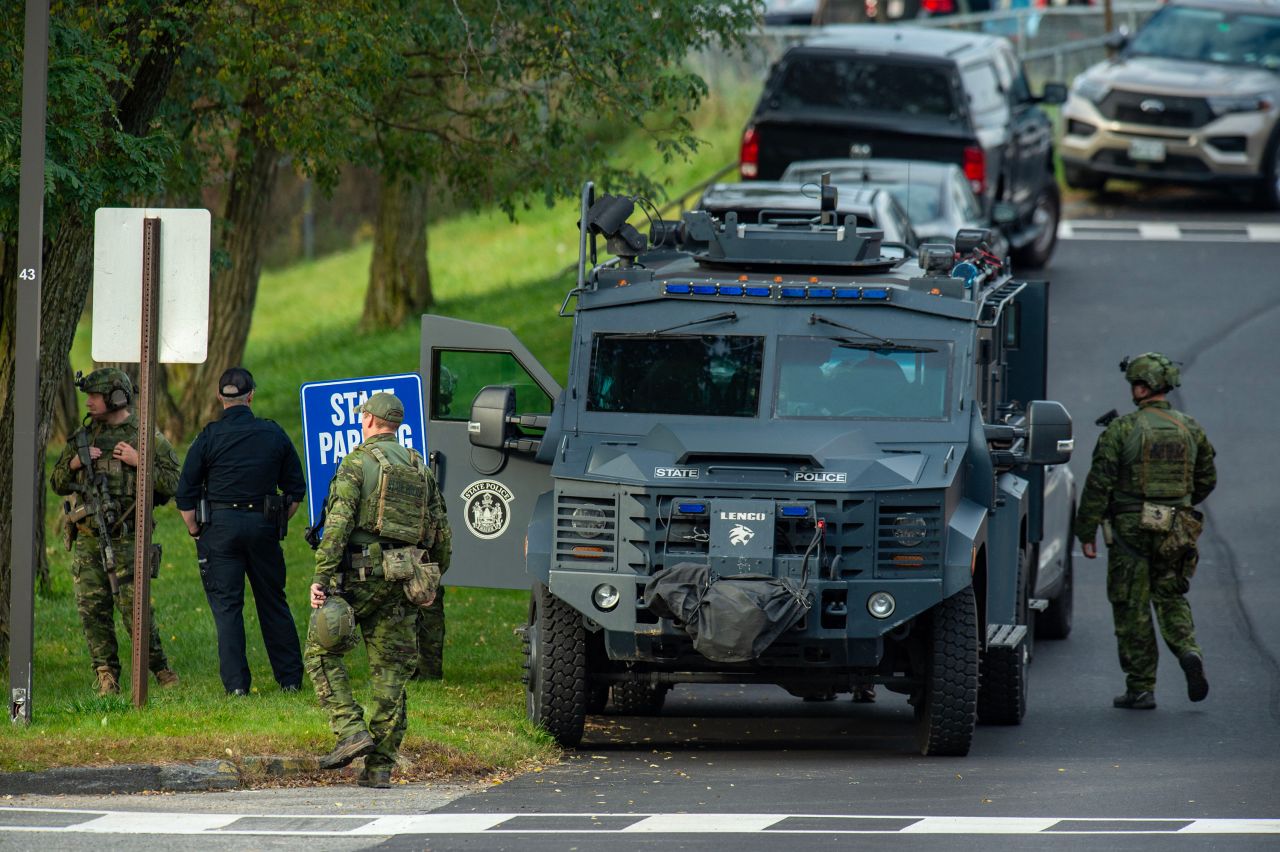 Law enforcement officers gather in Lewiston, Maine, on October 26. 