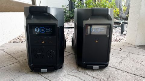 The EcoFlow Delta Pro solar generator, with an extension battery, set up side by side on a stone patio