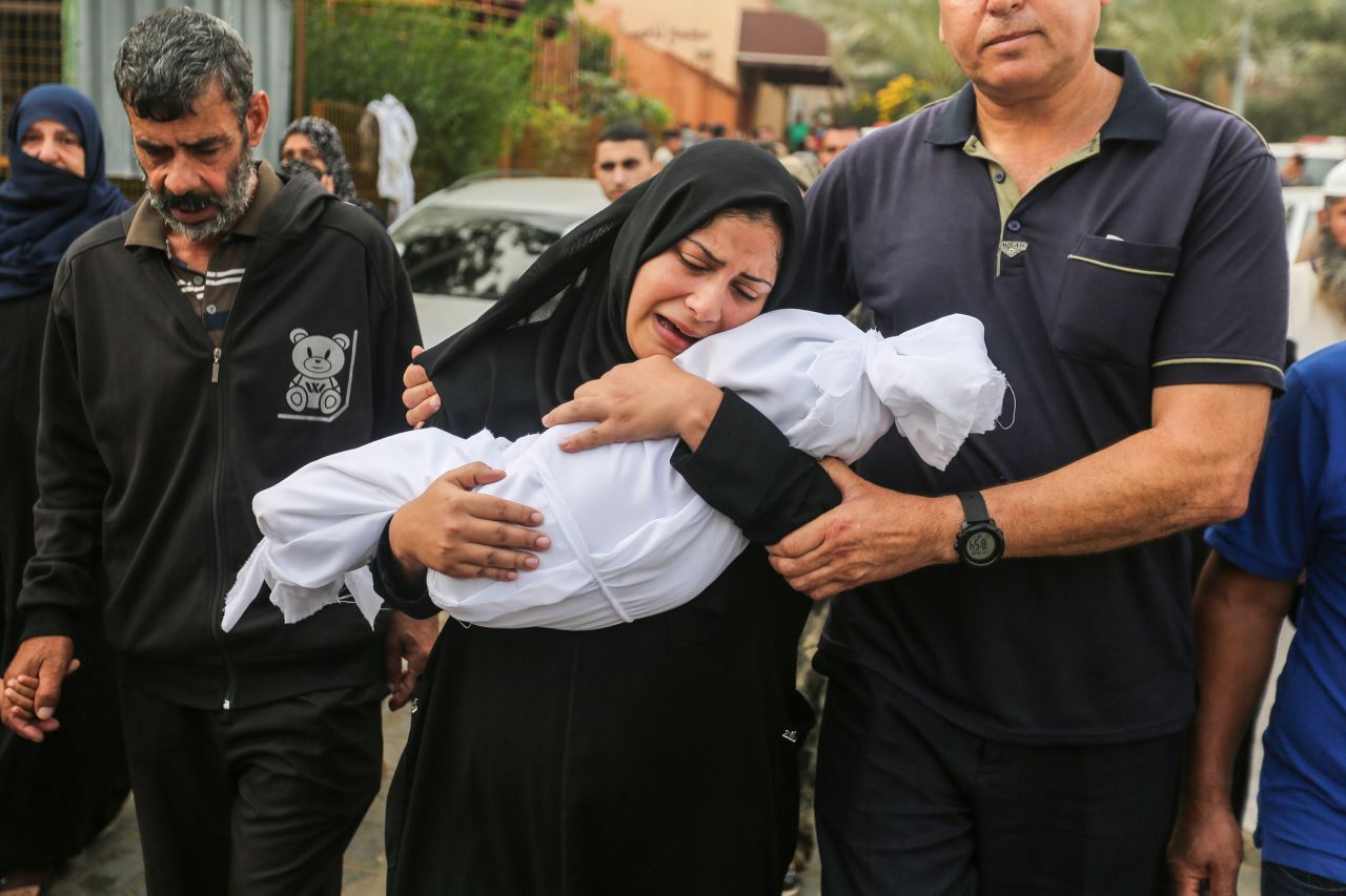 People mourn Palestinians killed in Israeli airstrikes in Khan Younis, Gaza, on October 28.