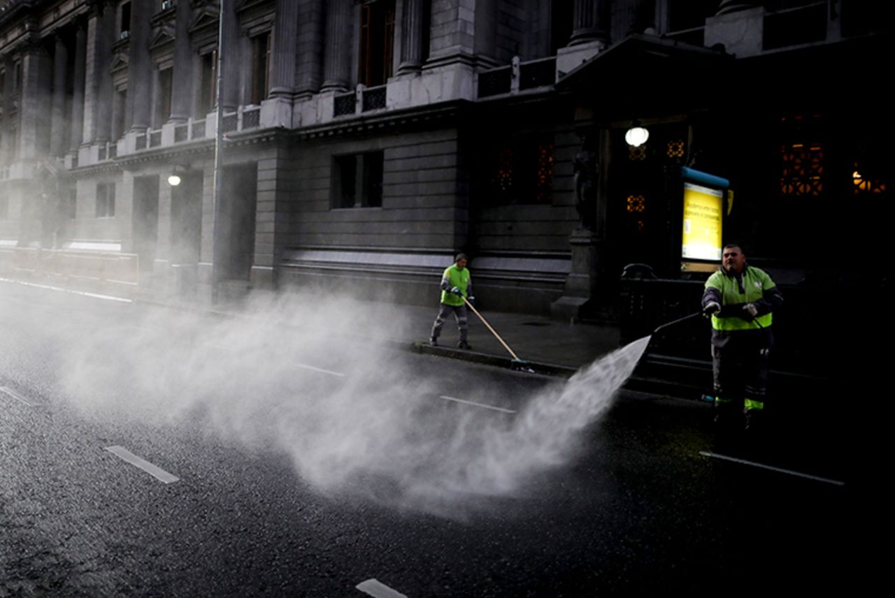 A worker disinfects the street outside Congress during a government-ordered lockdown t in Buenos Aires, Argentina, Wednesday, April 8. 