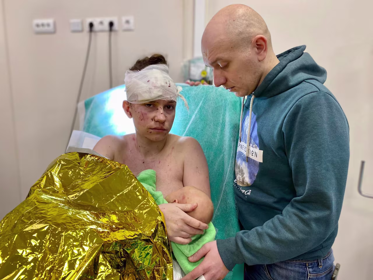 Olga and her husband Dmytro at the Ohmatdit Children's Hospital. According to the hospital, Olga covered the baby with her body, miraculously saving her daughter from injuries.