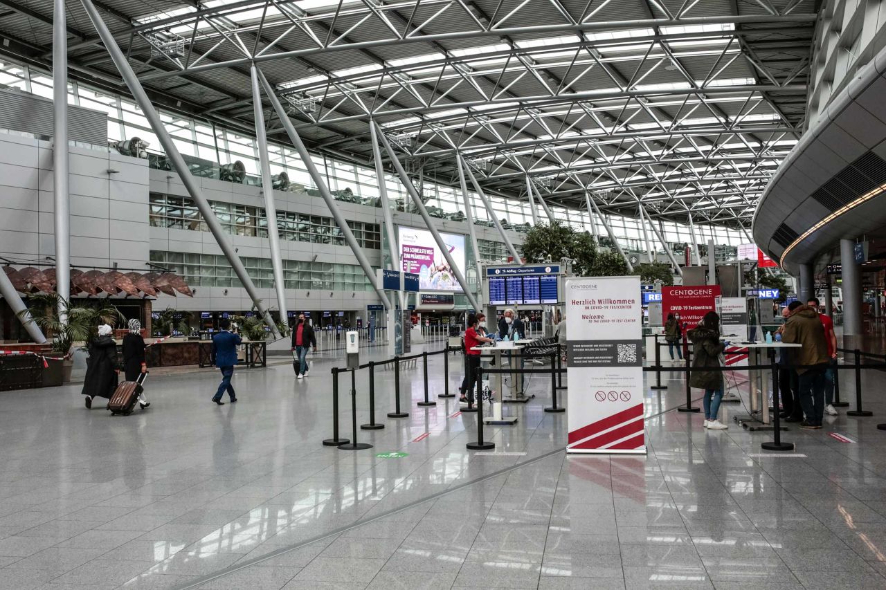 Travelers register at a Covid-19 test center in Germany's Duesseldorf Airport on Wednesday, September 30.