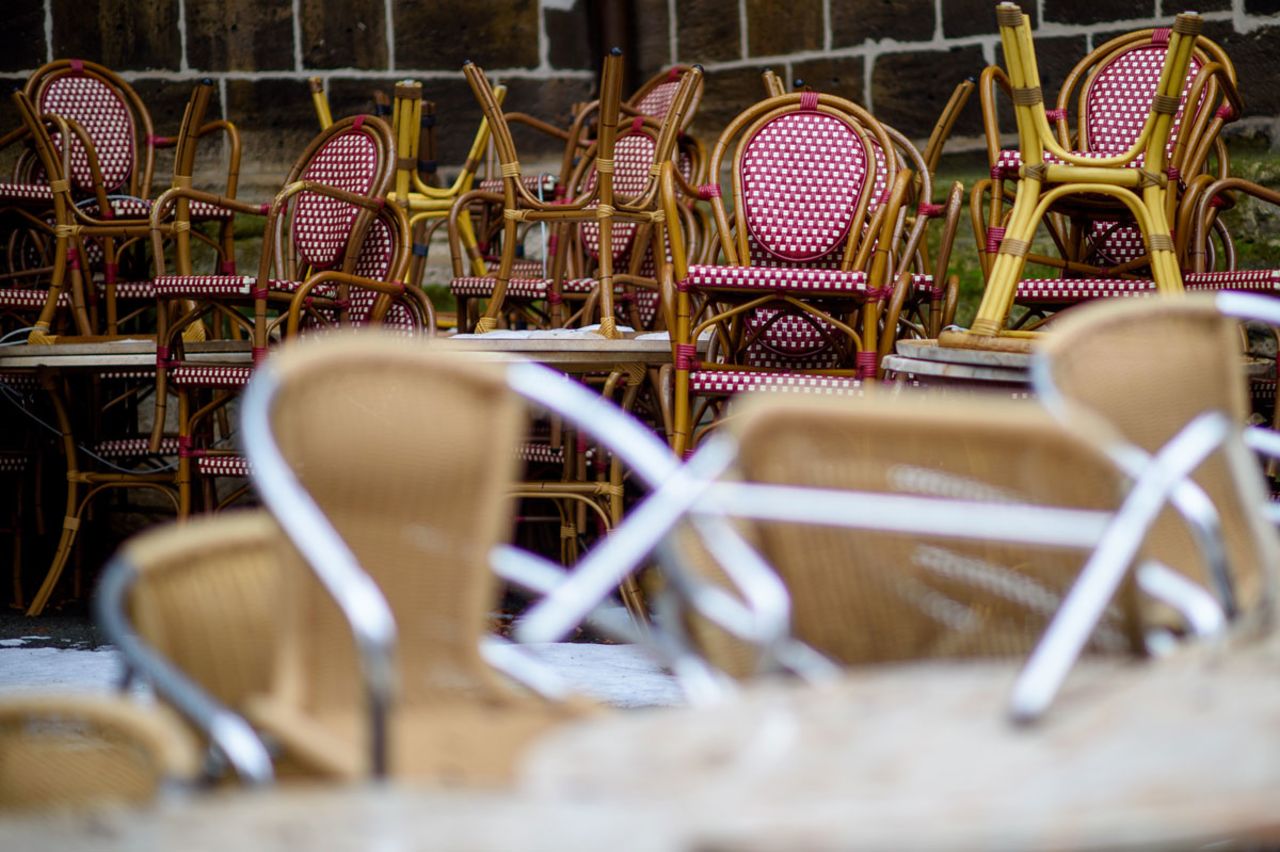 Chairs of a coffee shop are stacked in the empty town of Quedlinburg, Germany on February 3.