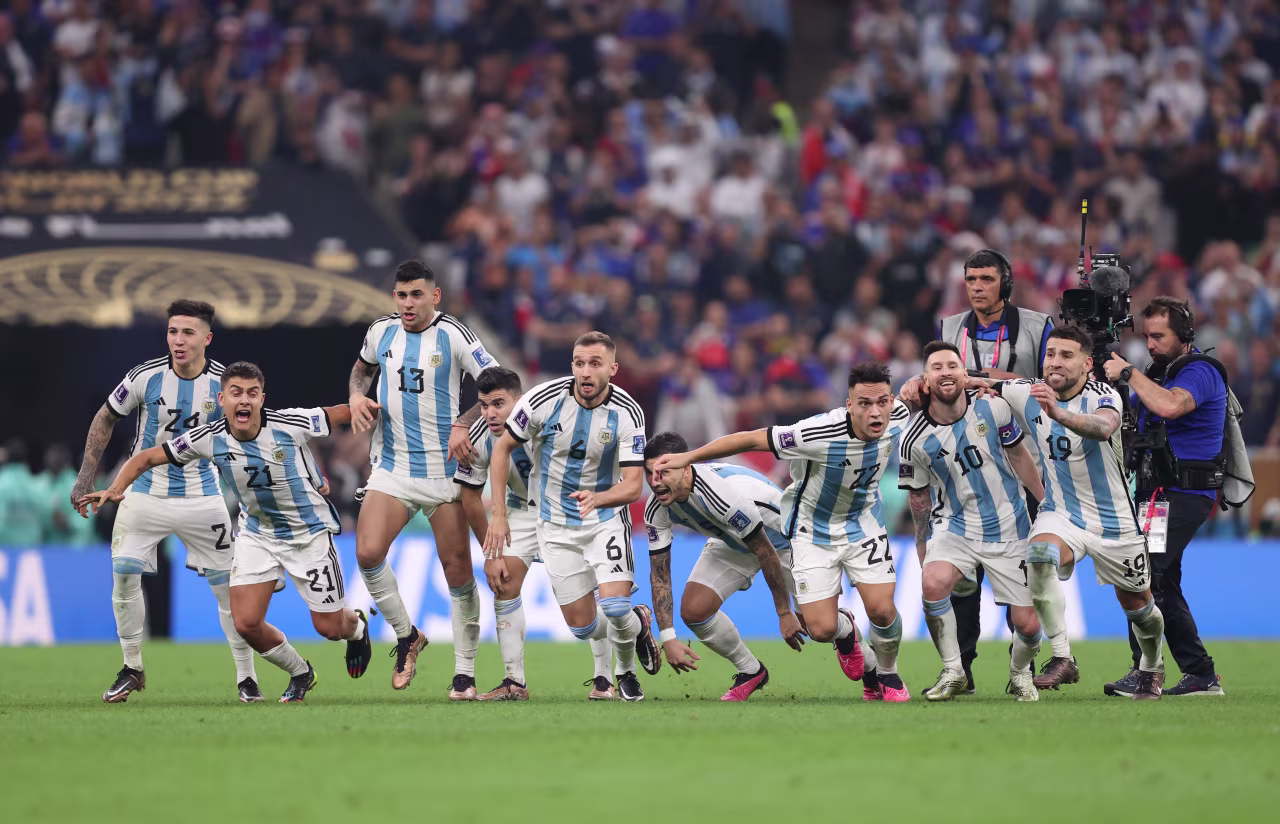 Argentina players celebrate after Gonzalo Montiel scored the tournament-winning penalty in the shootout.