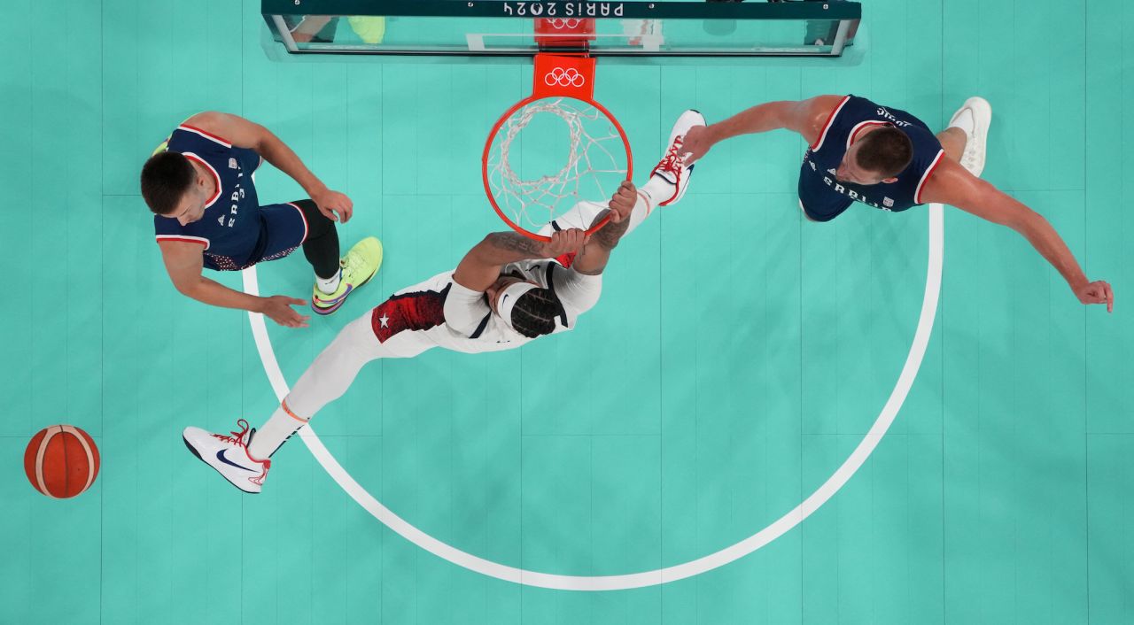 Anthony Davis of the United States is seen in action with Filip Petrusev and Nikola Jokic of Serbia.