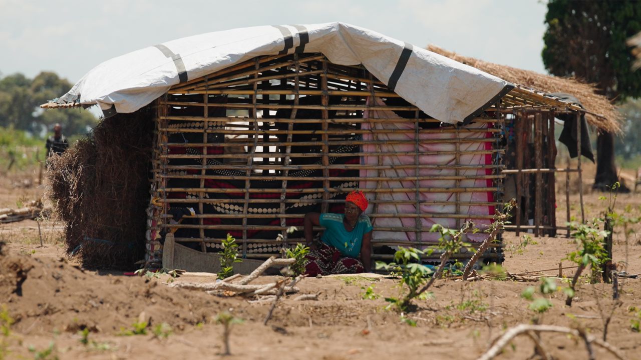 A woman sits outside a makeshift shelter at the Eduardo Mondlane camp for the internally displaced, outside Mueda town, northern Mozambique. Many new arrivals who have fled the recent ISIS offensive build new homes from bamboo and tarpaulins, bound together with used fishermen’s netting, and enter the camps with almost no food or possessions.