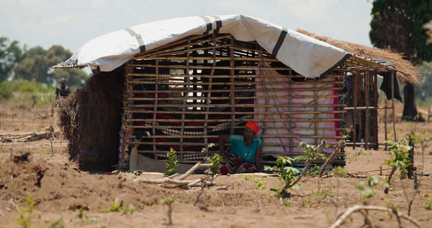 A woman sits outside a makeshift shelter at the Eduardo Mondlane camp for the internally displaced, outside Mueda town. Many new arrivals who have fled the recent ISIS offensive enter the camps with almost no food or possessions.