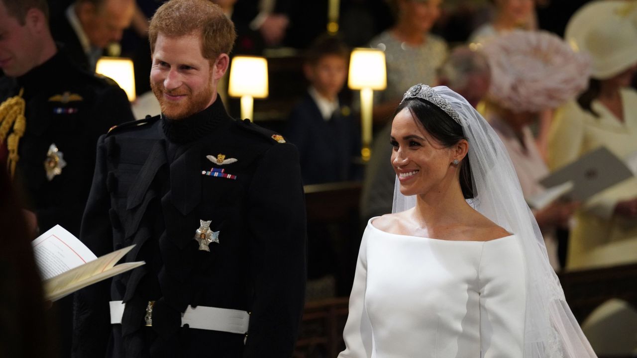 Prince Harry stands with his bride, Meghan Markle.