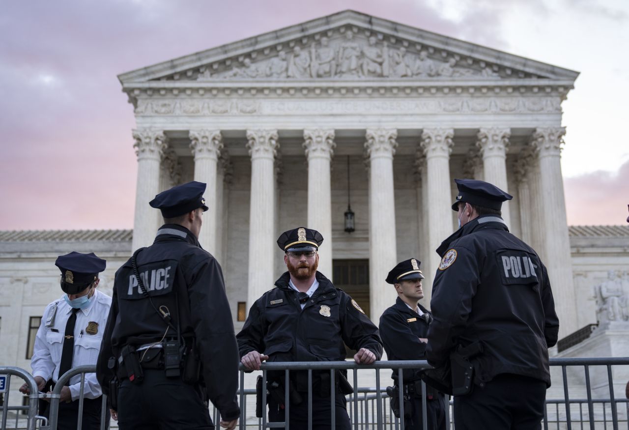 Supreme Court police officers set up security barricades outside the Supreme Court building on Monday morning in Washington, DC. The Supreme Court will hear arguments in a challenge to the controversial Texas abortion law. 