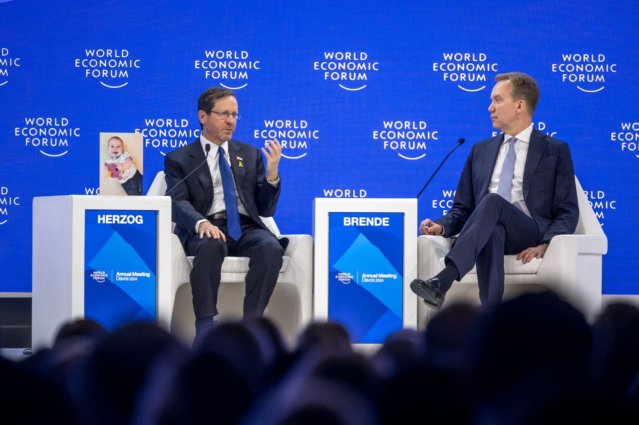 Israeli President Isaac Herzog, left, speaks with WEF president Borge Brende during a session of the World Economic Forum (WEF) meeting in Davos, Switzerland, on January 18.