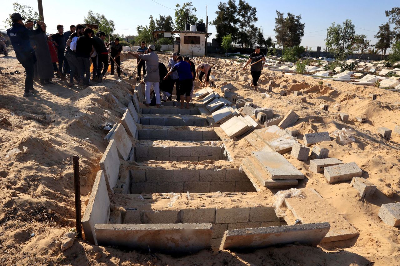 Graves are prepared at a cemetery in Rafah, Gaza, on Octobers 15. 