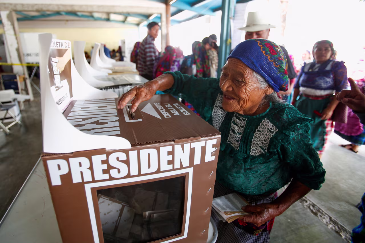 A woman casts her ballot at a polling station in San Bartolome Quialana, Mexico, on Sunday. 