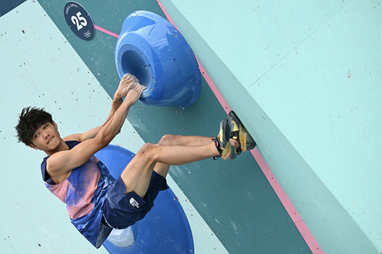 Japan's Sorato Anraku competes in the men's sport climbing boulder final on August 9.  