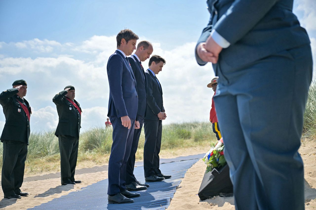 France's Prime Minister Gabriel Attal, left, Britain's Prince William, the Prince of Wales, center and Canadian Prime Minister Justin Trudeau pay their respects after laying a wreath during the Canadian commemorative ceremony marking the 80th anniversary of the World War II D-Day Allied landings in Normandy, at the Juno Beach Centre near the village of Courseulles-sur-Mer, France, on June 6.