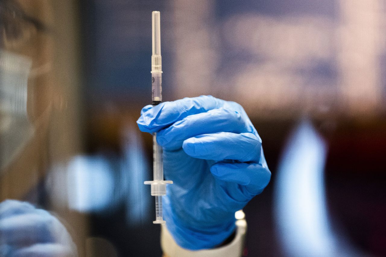 A pharmacist prepares a dose of the Pfizer/BioNTech Covid-19 vaccine at a mass vaccination site at Boston's Fenway Park on January 29.