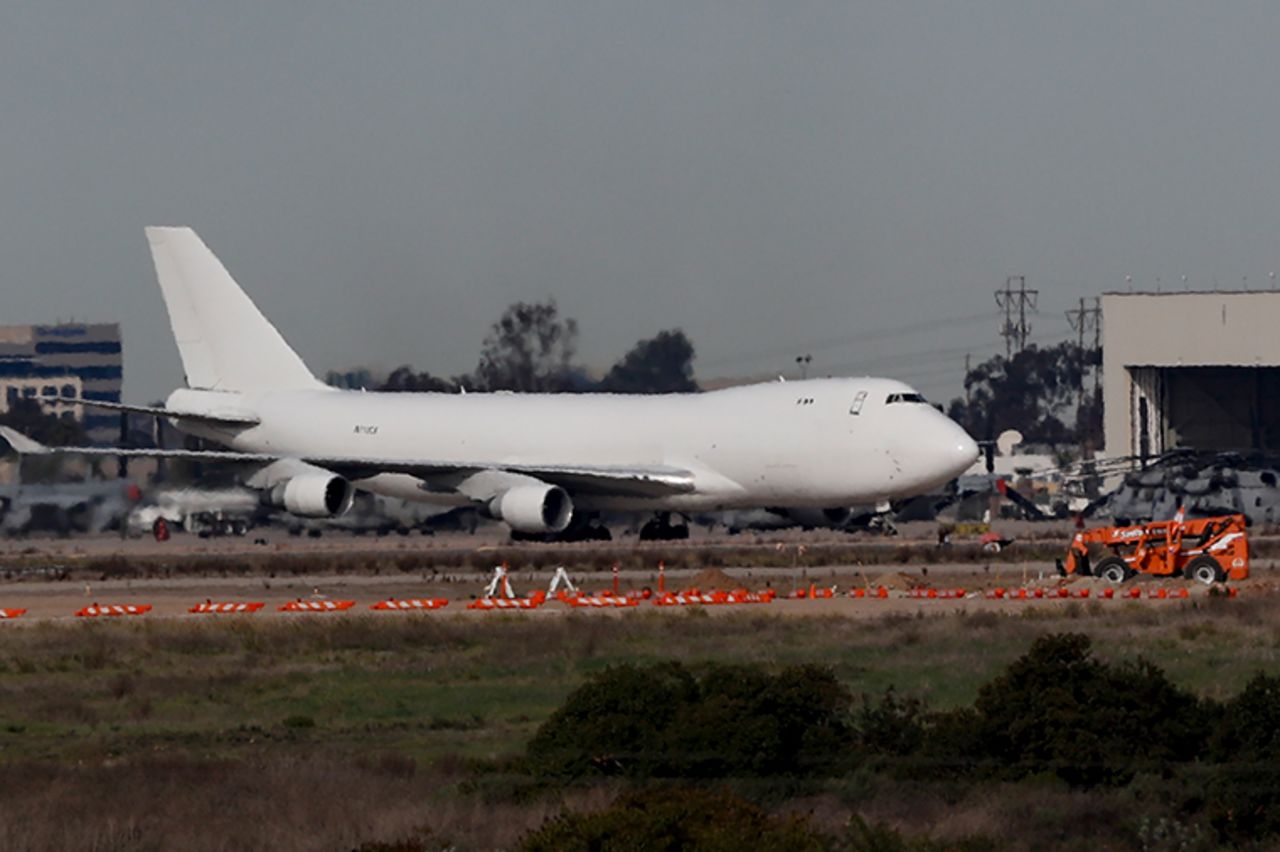 A plane carrying evacuees from the virus zone in China lands at Marine Corps Air Station Miramar Wednesday, February 5. 