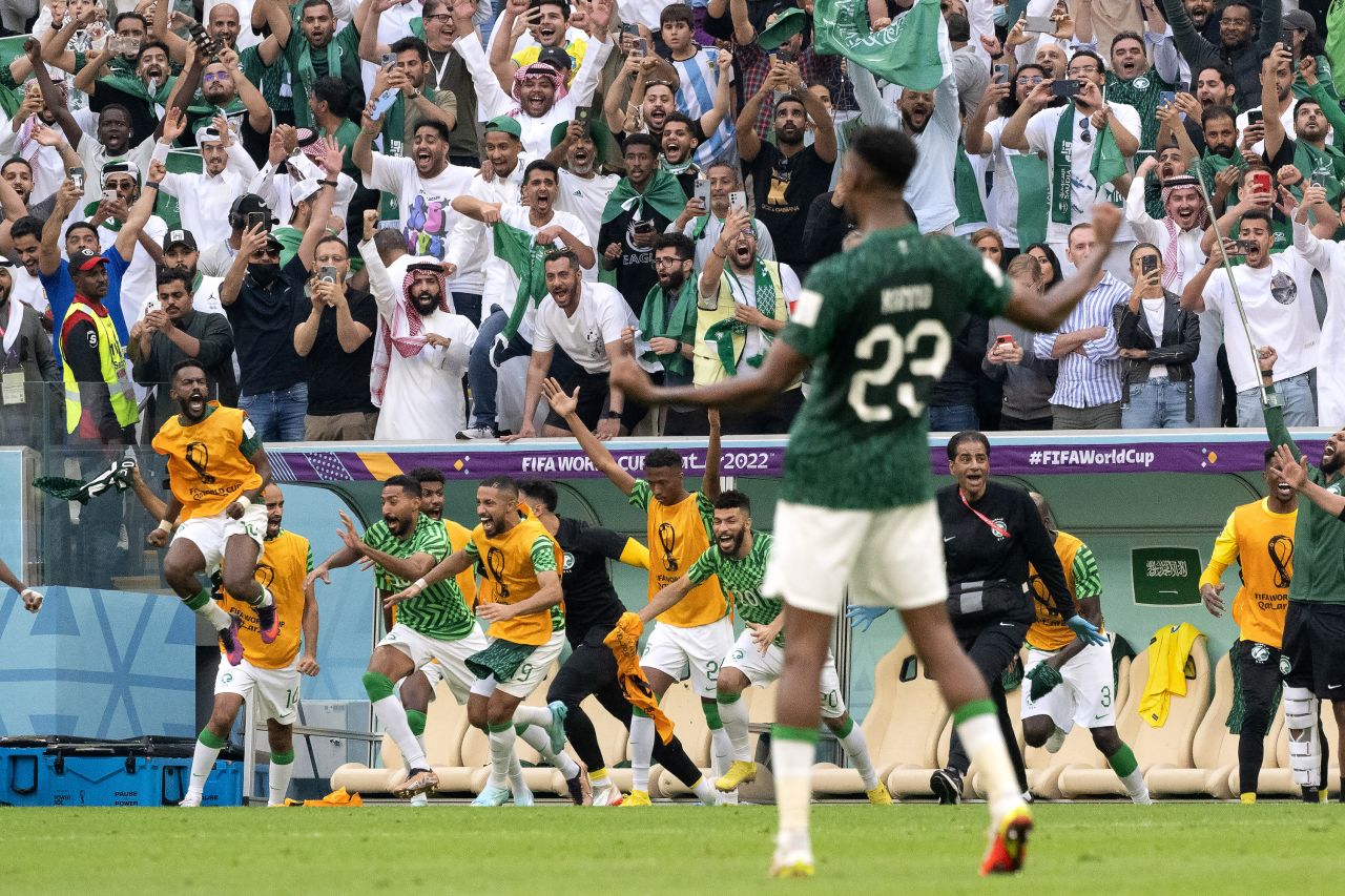 Players of Saudi Arabia celebrate their victory after the match between Argentina and Saudi Arabia at Lusail Stadium in Lusail City, Qatar on November 22.