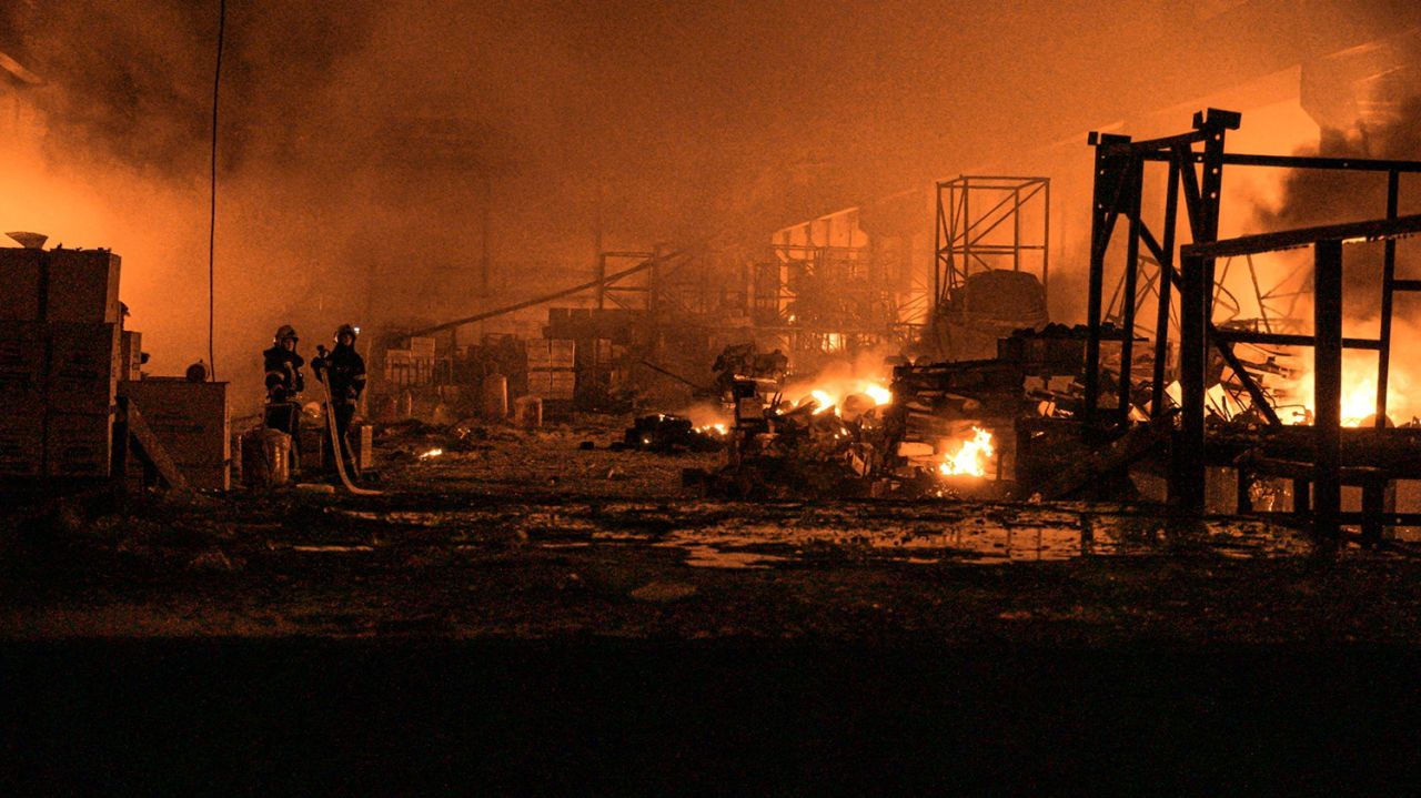 Firefighters work at a site of warehouse damaged by a Russian missile strike in Ternopil, Ukraine, in this handout picture released May 14. 