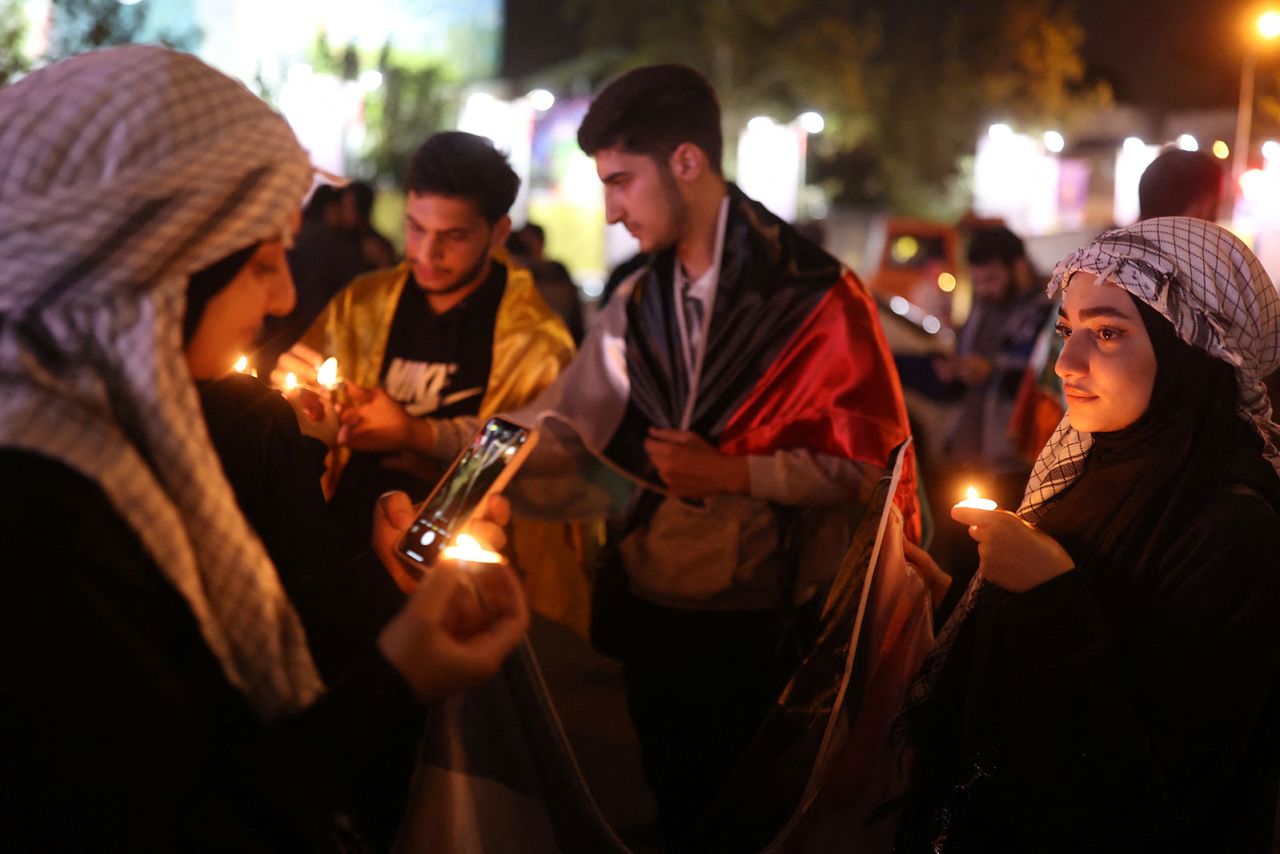 People light candles during a gathering in support of Palestinians, in Tehran,?Iran, October 17, 2023.