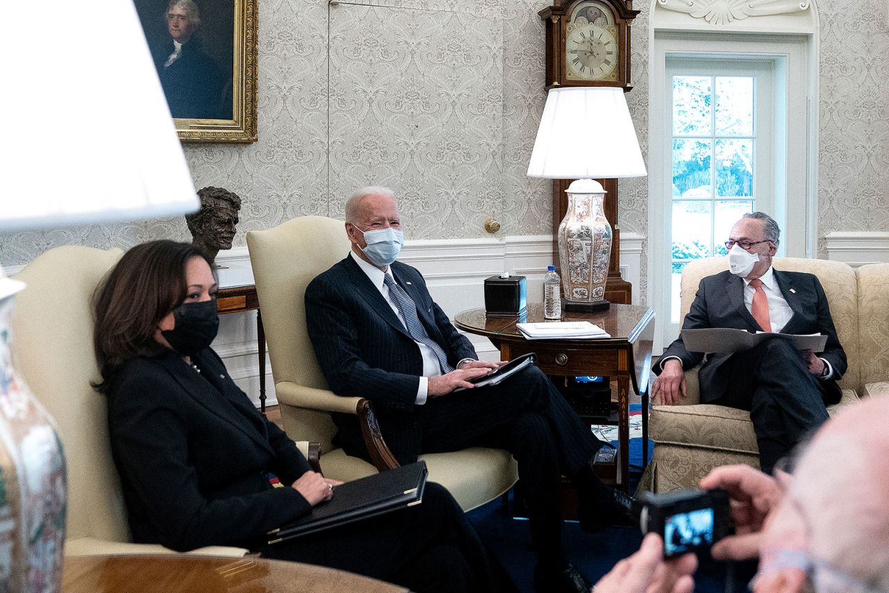 From left, Vice President Kamala Harris, President Joe Biden and Senate Majority Leader Chuck Schumer meet with Democratic senators in the Oval Office to discuss Biden's Covid-19 relief package on February 3.