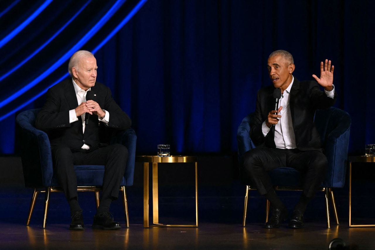 President Joe Biden listens as former President Barack Obama speaks onstage during a campaign fundraiser at the Peacock Theater in Los Angeles on June 15.