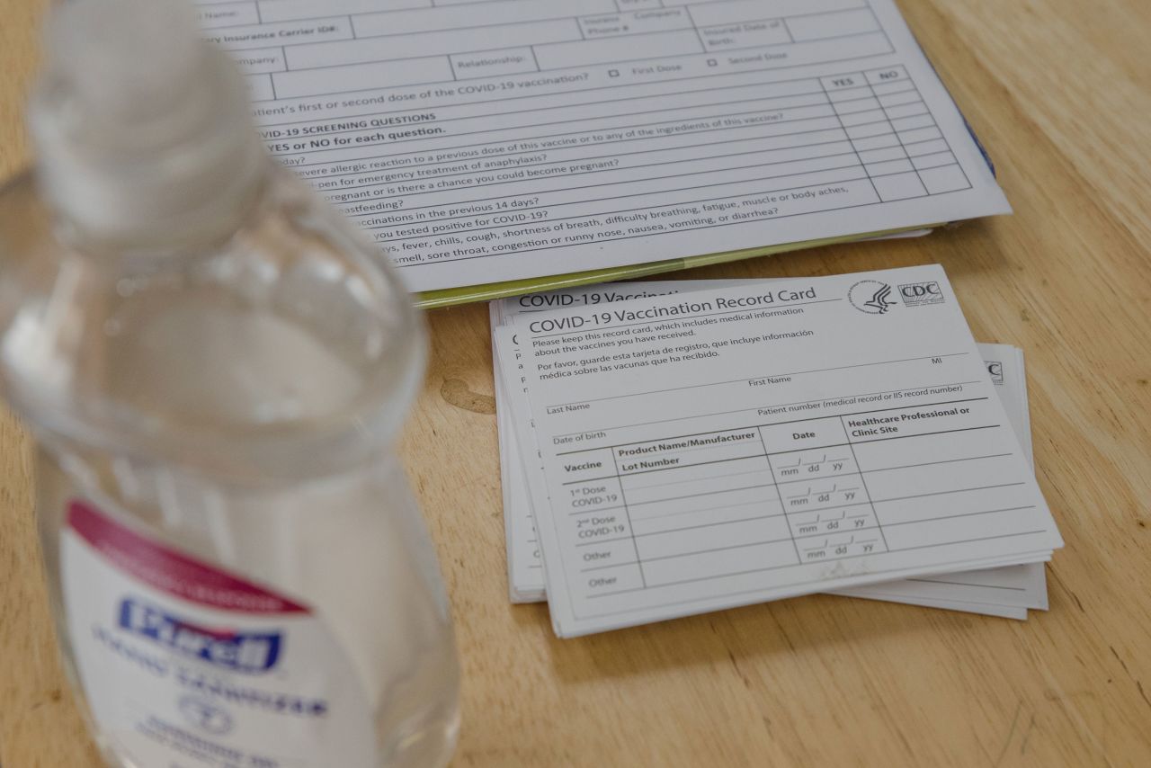 Blank vaccination cards sit on a table at a Family Heath Center mobile Covid-19 vaccination site in Santee, South Carolina, on Tuesday, July 13.