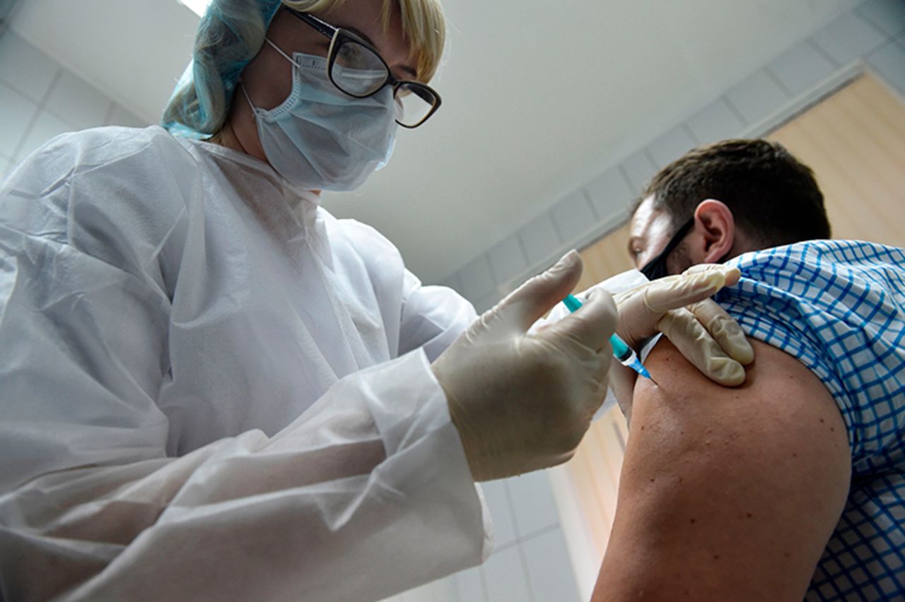 A nurse inoculates a volunteer with Russia's new coronavirus vaccine in a post-registration trials at a Moscow clinic on September 10.