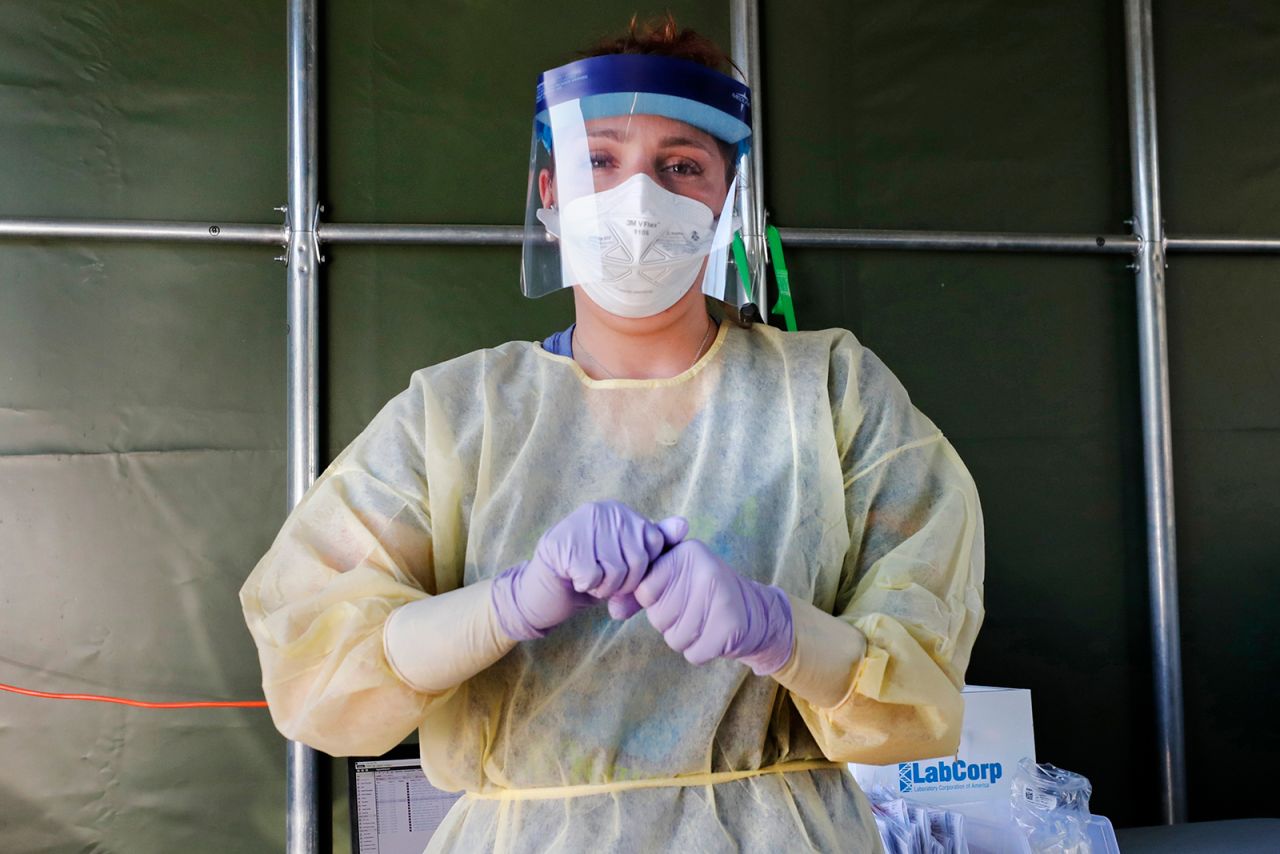 A medical worker prepares to administer a Covid-19 virus test at a drive-thru care testing site at the Derry Medical Center on Wednesday, June 17, in Derry, New Hampshire.