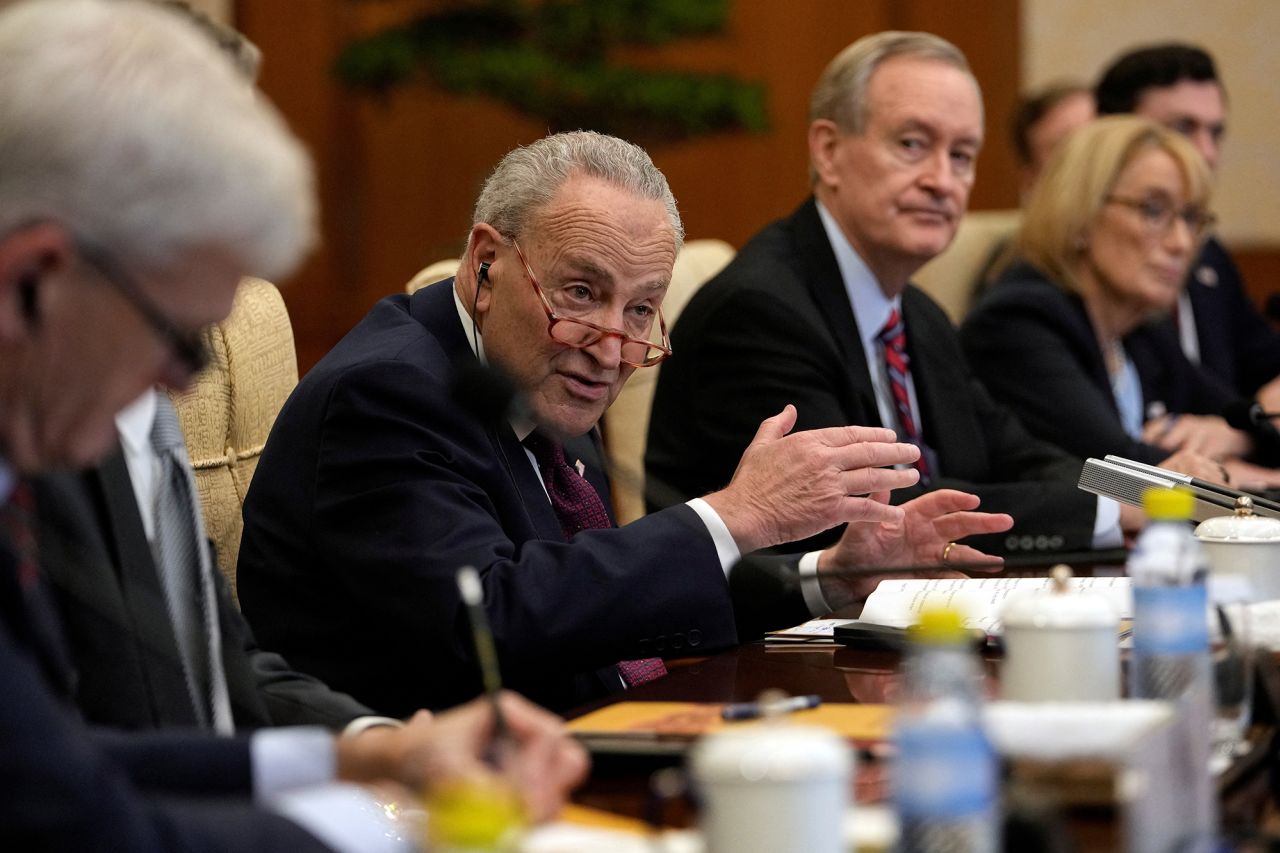 Visiting U.S. Senate Majority Leader Chuck Schumer, center, speaks during a bilateral meeting with Chinese Foreign Minister Wang Yi at the Diaoyutai Guest House in Beijing, China, on October 9.