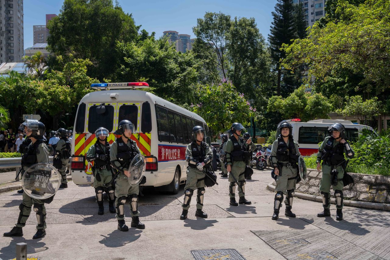 Riot police stand guard at Wong Tai Sin on August 5 in Hong Kong.