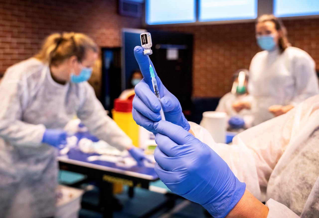 A nurse prepares a syringe with the Covid-19 vaccine as residents are vaccinated in Drammen, Norway, on January 21.