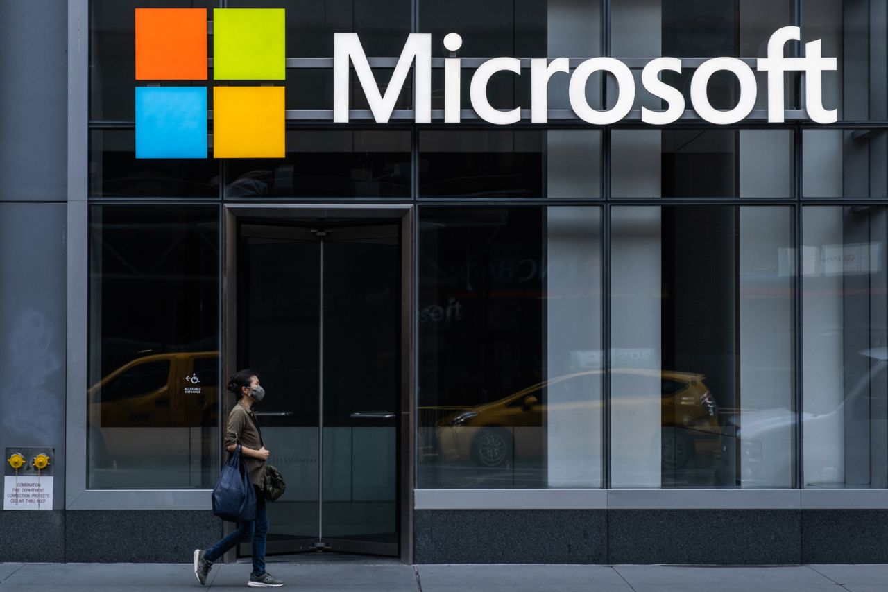 A pedestrian walks past a Microsoft Technology Center in New York City on July 22.