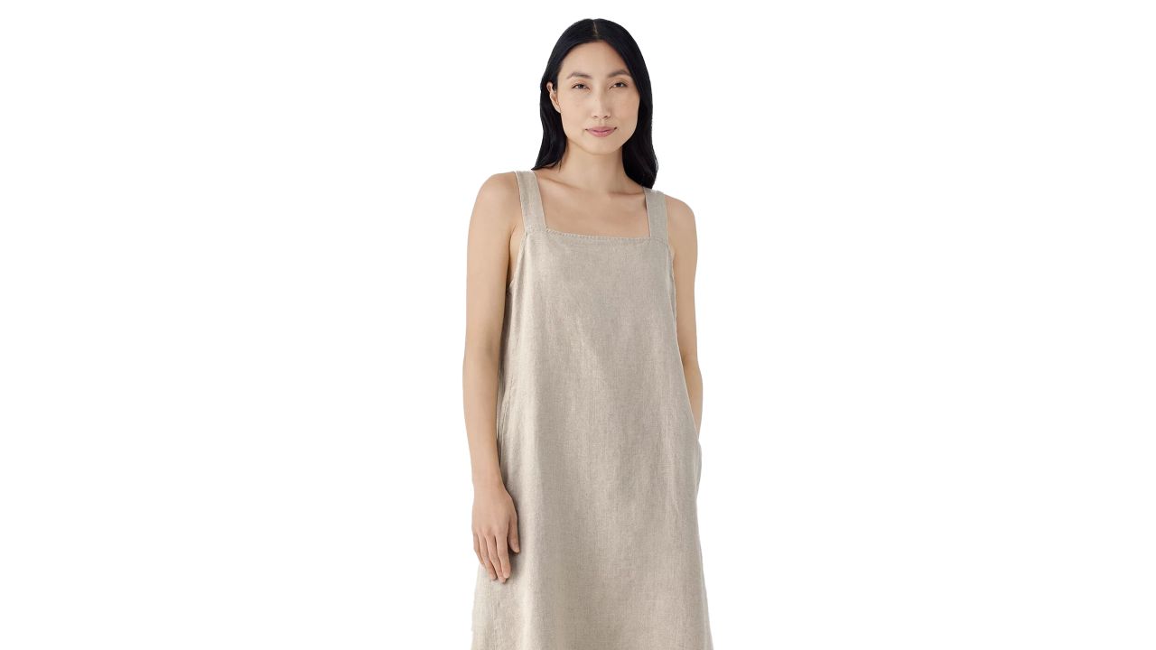 Woman wearing eileen fisher organic linen square neck dress in undyed natural color